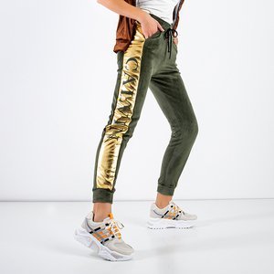 Dunkelgrüne isolierte Jogginghose für Frauen mit goldenen Streifen - Odież