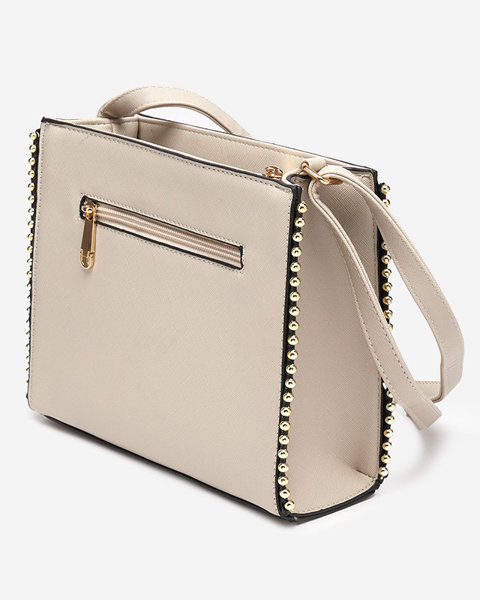 Klassische beige Handtasche mit Dekoration - Accessoires