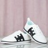 Schwarz-weiße Sportschuhe, die ich fühlen muss - Schuhe