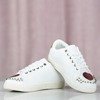 Weiße Sportschuhe mit Nollisoa-Nieten - Schuhe