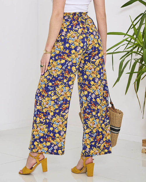 Жіночі сині штани палаццо з темно-синіми квітами - Одяг