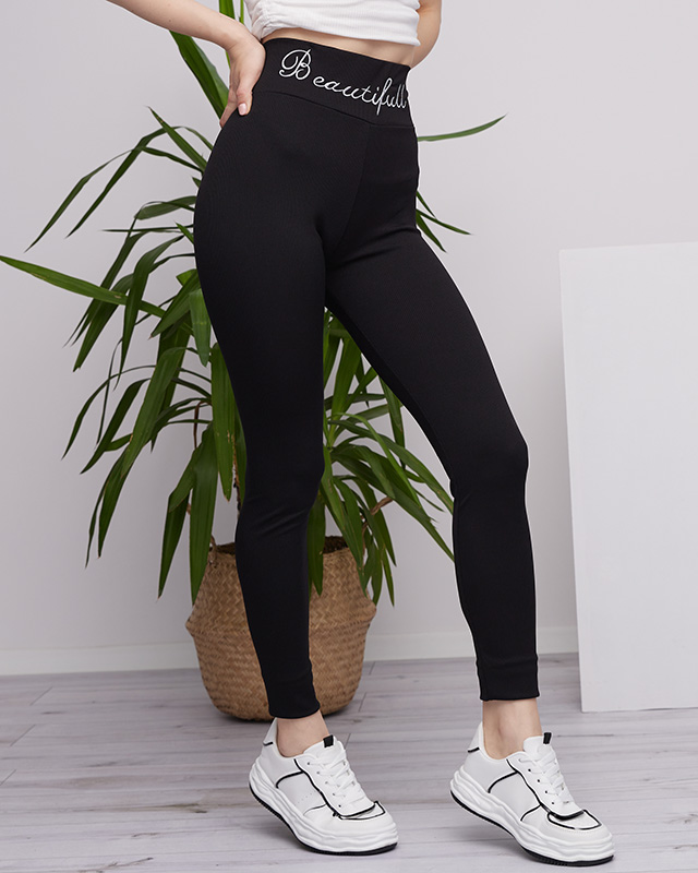 Schwarze, gerippte Damen-Leggings mit gesticktem Text - Kleidung