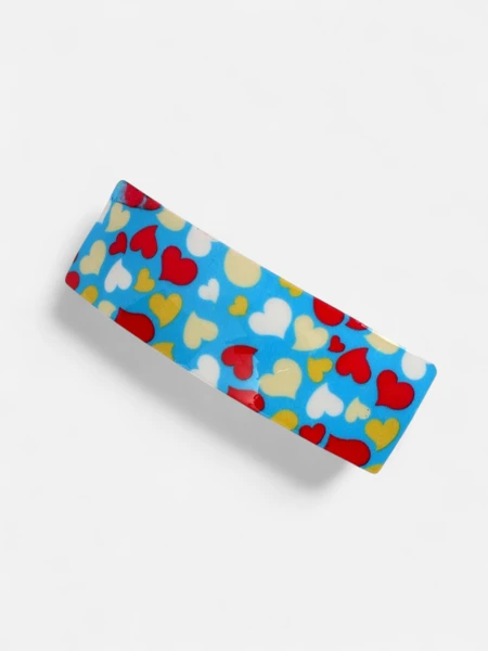 Farbenfrohe Kinderhaarspange mit Herzen