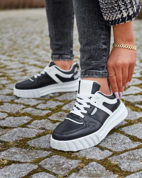 Жіночі повсякденні спортивні туфлі з екошкіри чорного кольору з білими вставками Netiris - Взуття