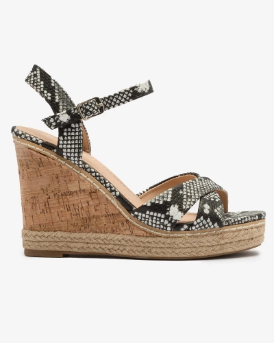 Чорно-білі жіночі босоніжки на танкетці з тисненням Certika - Взуття