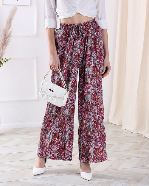 Жіночі брюки з візерунком на широких штанинах червоного кольору - Одяг