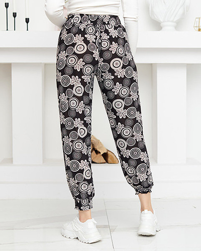 Schwarz-weiße Damenhose mit PLUS SIZE-Aufdruck - Kleidung
