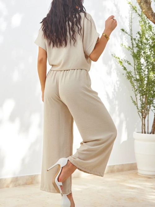 Royalfashion Жіночий комплект з зав'язаною сорочкою з коротким рукавом та розкльошеними штанами з стразами