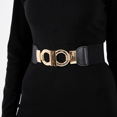 Чорний еластичний ремінь з декоративною золотою пряжкою