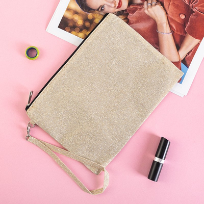 Золота косметичка з блискітками