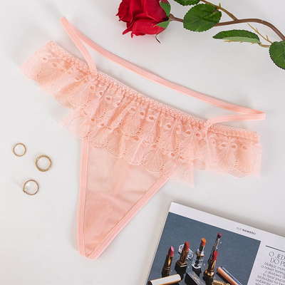 Мереживні стрінги в персиковому кольорі - Нижня білизна
