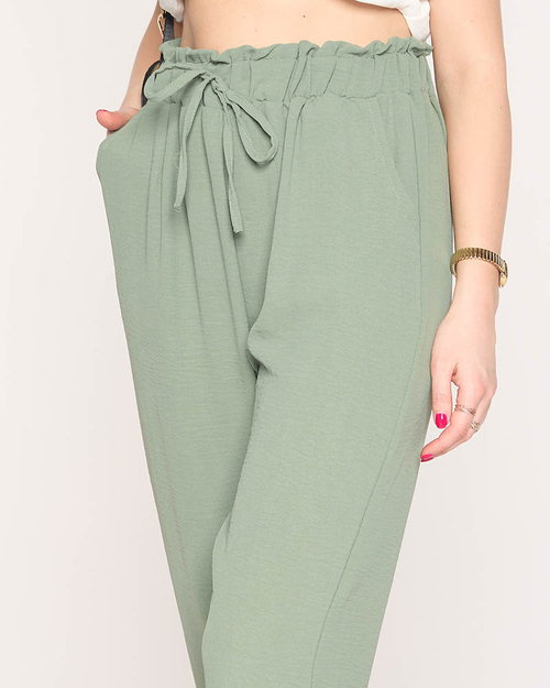 Жіночі тканинні штани зеленого кольору PLUS SIZE - Одяг