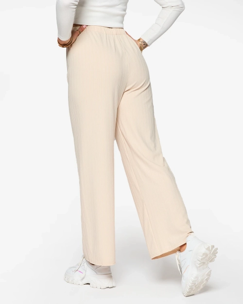 Бежеві жіночі широкі брюки в рубчик - Одяг