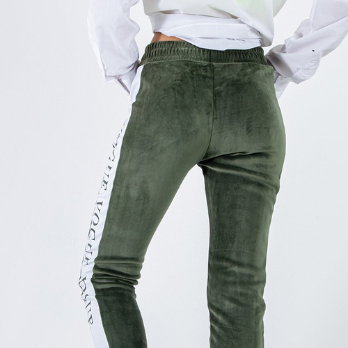 Зелені жіночі утеплені спортивні штани лампасами - Одяг