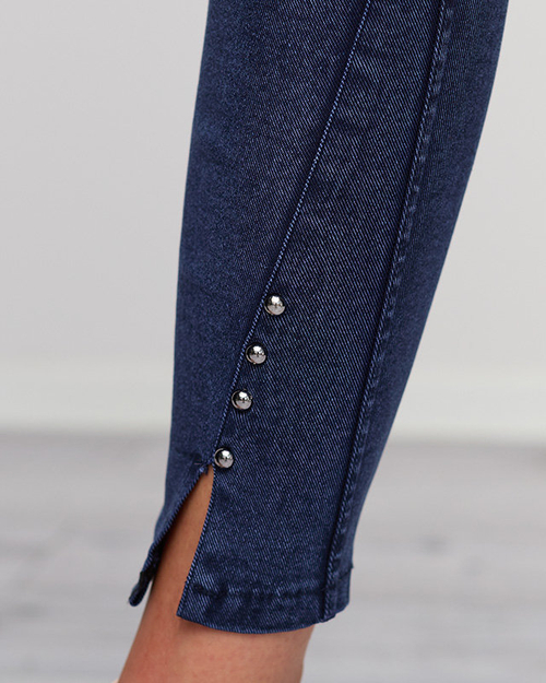 Темно-сині жіночі штани з вирізами і стразами