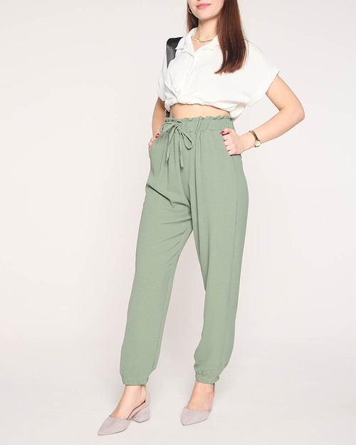 Жіночі тканинні штани зеленого кольору PLUS SIZE - Одяг