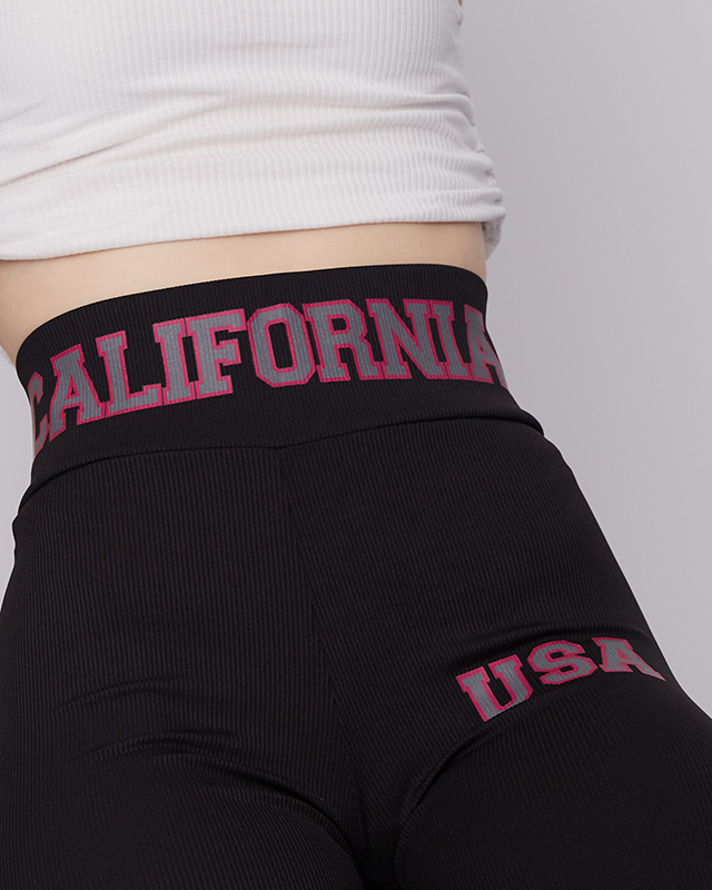 Schwarze gerippte Damen-Leggings mit rosa Aufschriften - Kleidung