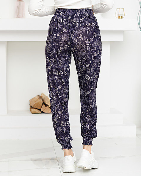 Бежеві та темно-сині жіночі штани з принтом - Одяг