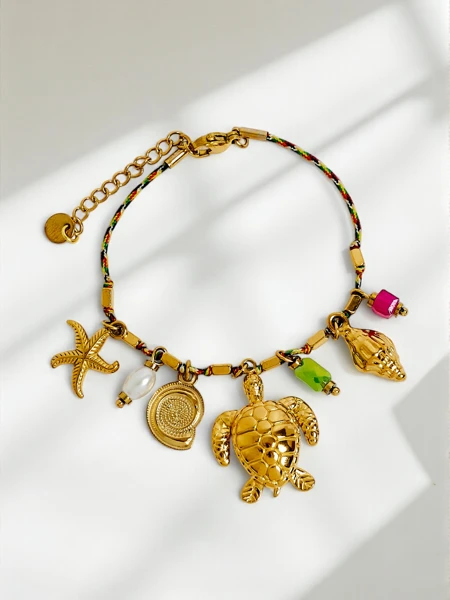 Vergoldetes Armband Aphrodite Maretta mit maritimen Anhängern und Perle