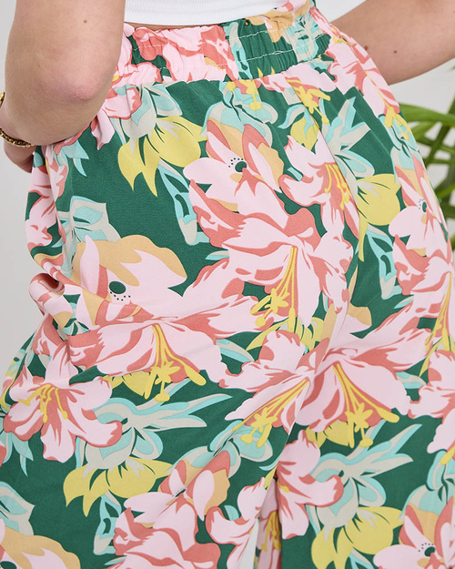 Жіночі зелені штани палаццо з рожевими квітами - Одяг