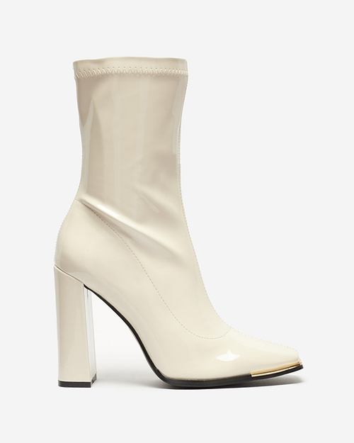Кремові лаковані жіночі чоботи на посту Рекіла - Взуття