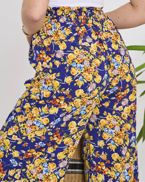 Жіночі сині штани палаццо з темно-синіми квітами - Одяг