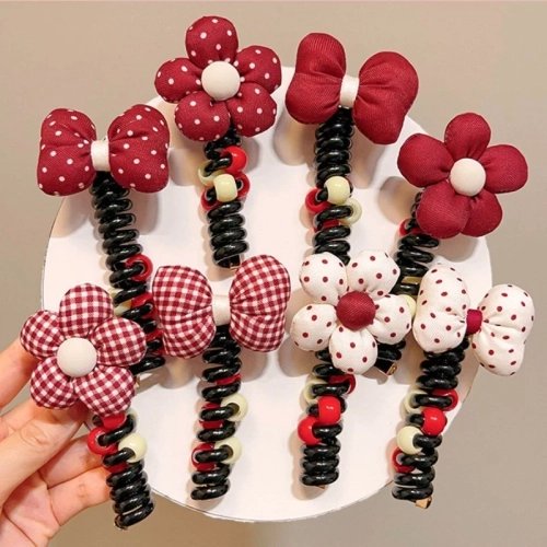 Royalfashion Гумка для волосся у вигляді спіралі з бантиком.