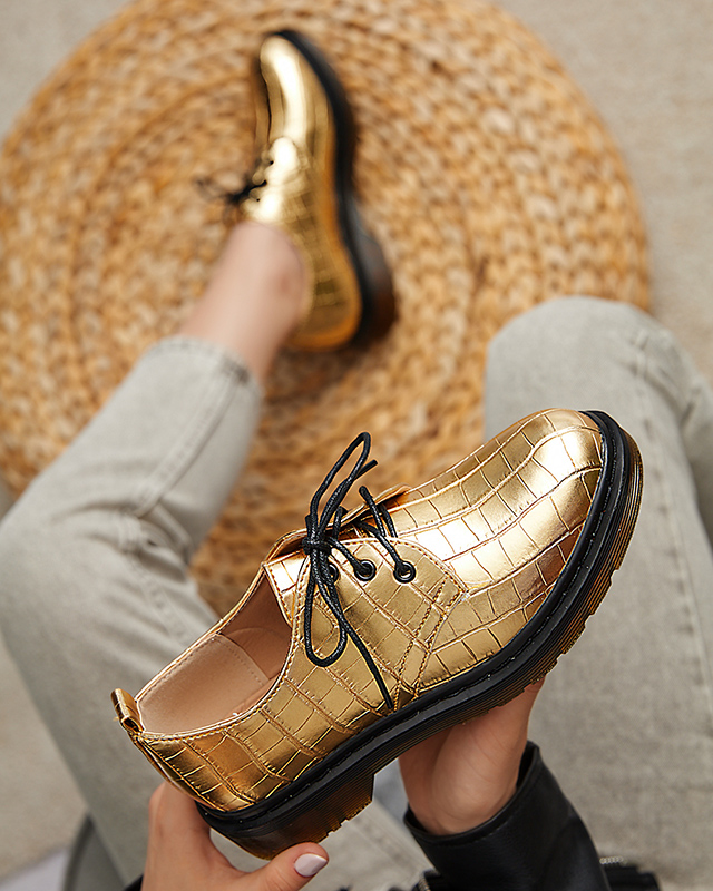 Goldener Damenschuh mit Seniri-Prägung - Schuhe