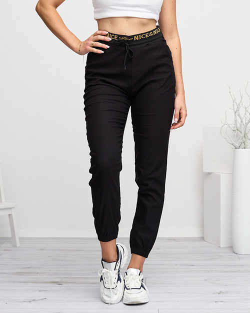 Чорні жіночі спортивні штани з золотими написами