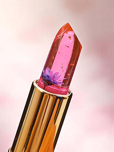 Transparenter Lipgloss mit eingearbeiteten blauen Blumen