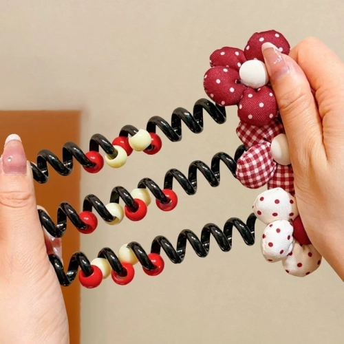 Royalfashion Гумка для волосся у вигляді спіралі з бантиком.