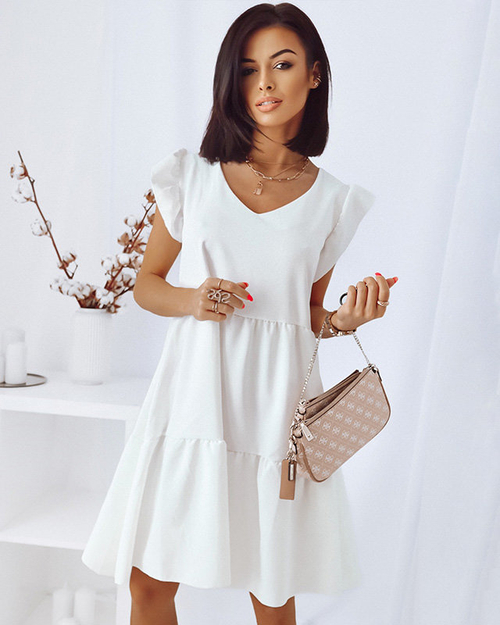 Біла сукня з воланами