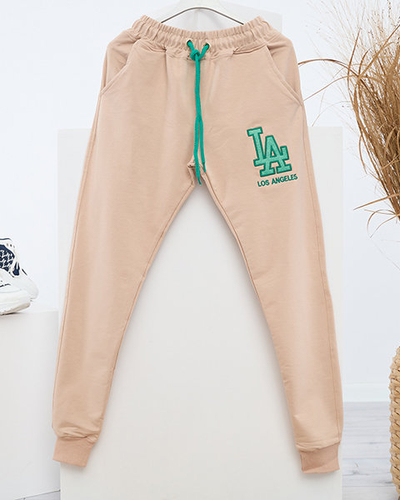 Beige Damen-Jogginghose mit farbigem Aufnäher - Kleidung