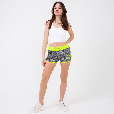 Neongelbe und schwarze Sportshorts für Damen - Kleidung