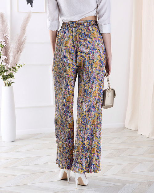 Жіночі візерункові брюки з широкими штанинами жовтого кольору - Одяг