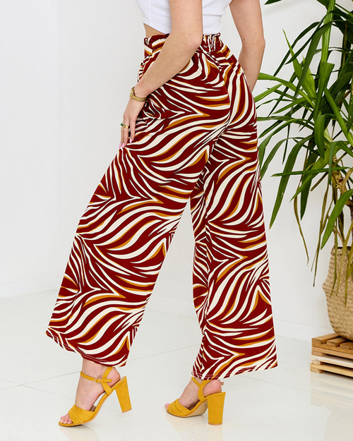 Візерункові жіночі штани палаццо червоного кольору - Одяг