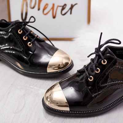 Schwarze Schuhe mit goldenem Zehenanzug - Schuhwerk