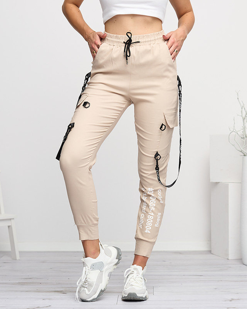 Бежеві жіночі штани з написами