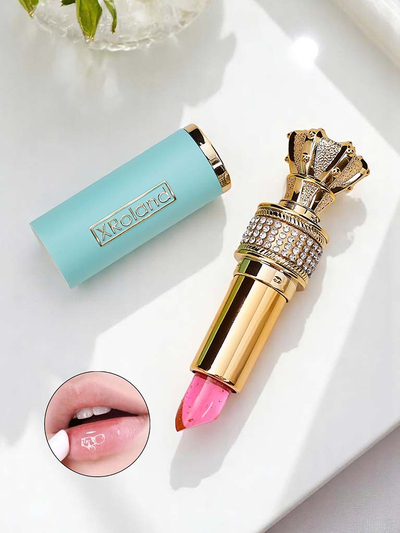 Transparenter Lipgloss mit eingearbeiteten blauen Blumen