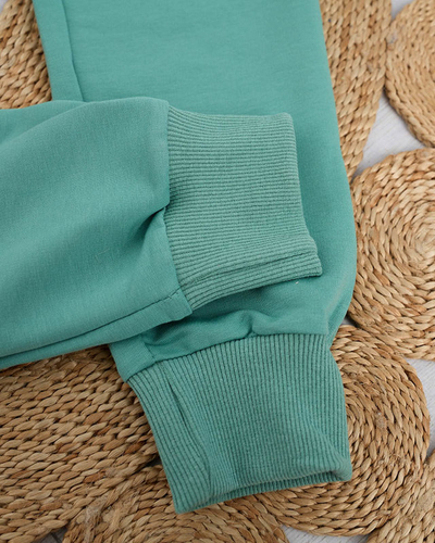 Grüne Damen-Jogginghose mit farbigem Aufnäher - Kleidung