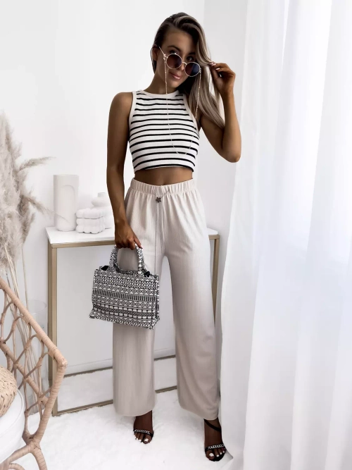 Бежеві жіночі широкі брюки в рубчик - Одяг