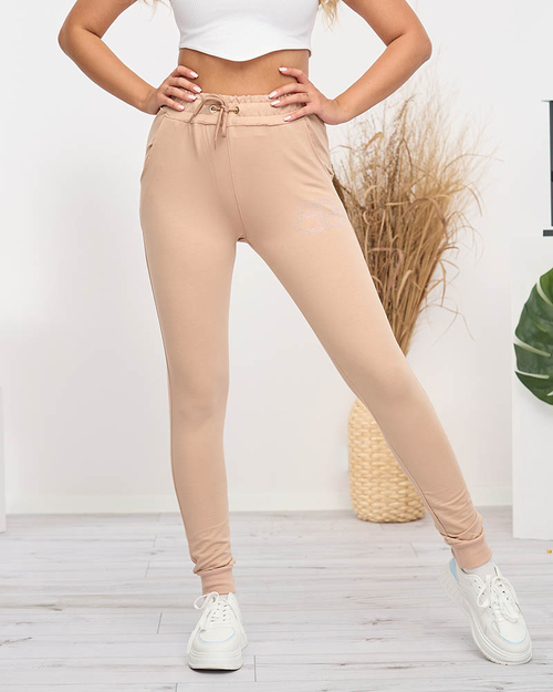 Жіночі бежеві спортивні штани з фіанітами - Одяг