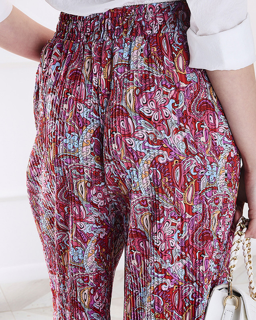Жіночі брюки з візерунком на широких штанинах червоного кольору - Одяг