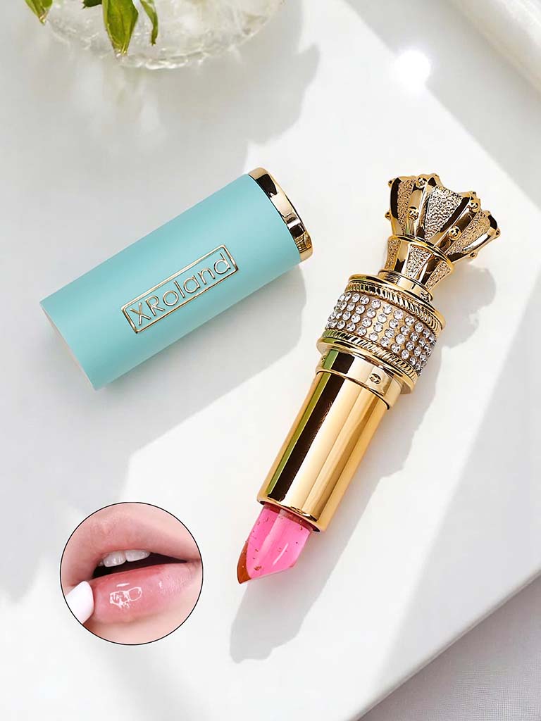 Transparenter Lipgloss mit eingearbeiteten blauen Blumen