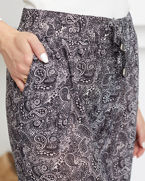 Чорно-білі жіночі штани з малюнком - Одяг