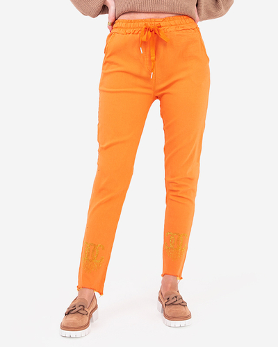 Damenhose aus orangefarbenem Stoff mit Zirkonia - Kleidung