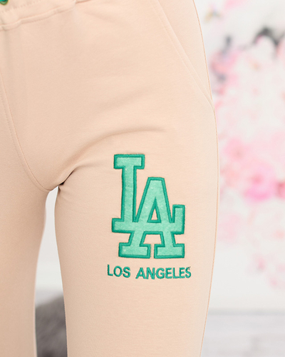 Beige Damen-Jogginghose mit farbigem Aufnäher - Kleidung