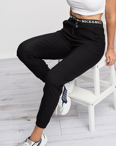 Schwarze Trainingsanzüge für Damen mit weißen Aufschriften - Kleidung