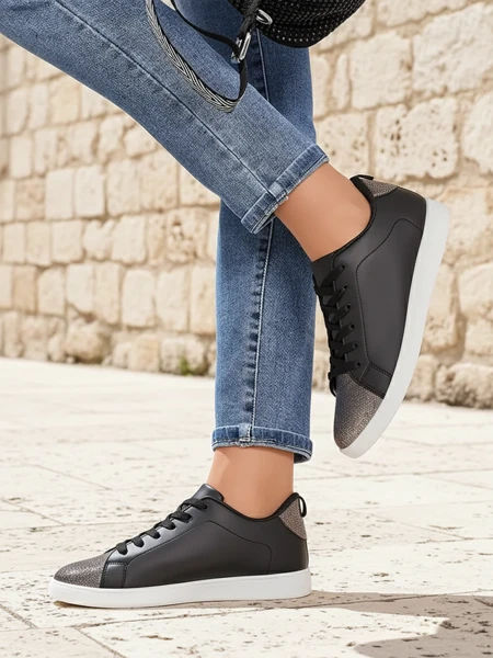 Damen-Sneakers Calista Nero – schwarze flache Lederschuhe für den Frühling