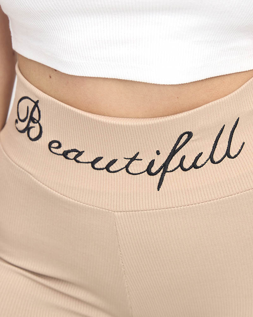 Світло-коричневі легінси в рубчик з вишитим написом